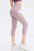 Person wearing light purple leggings with a pocket on a white background