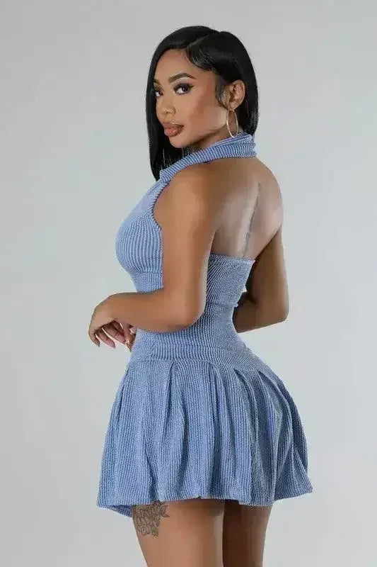 Women wearing a blue Romper skirt Set showing the side and back 