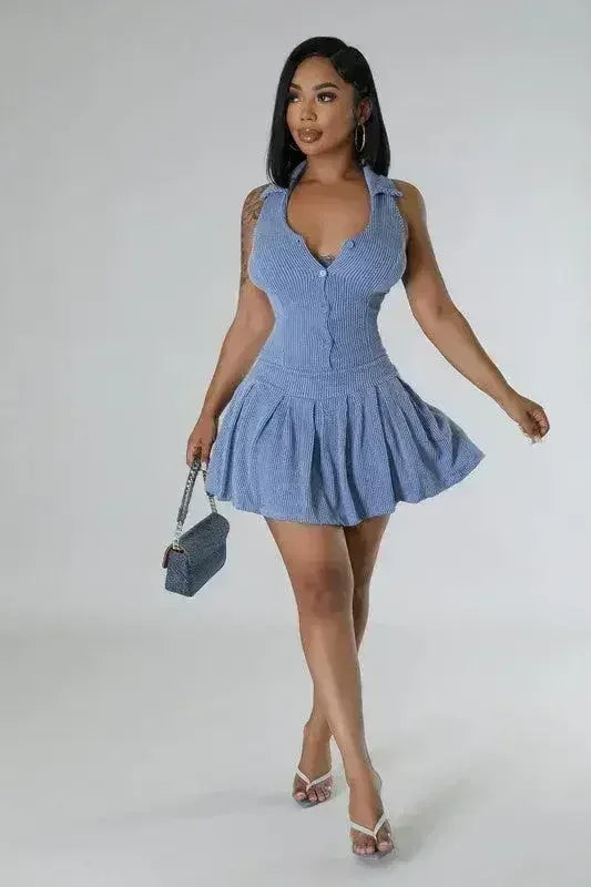 Women wearing a blue Romper skirt Set with matching blue bag