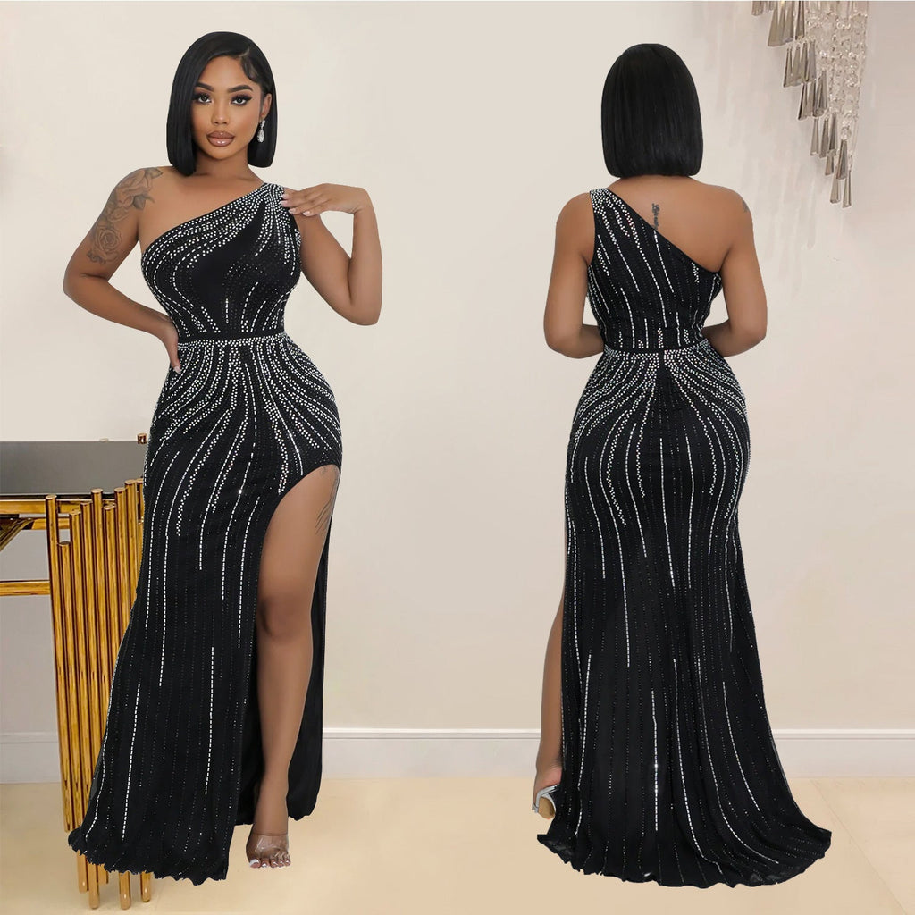 Woman wearing a black one-shoulder evening gown with silver embellishments, shown from front and back.