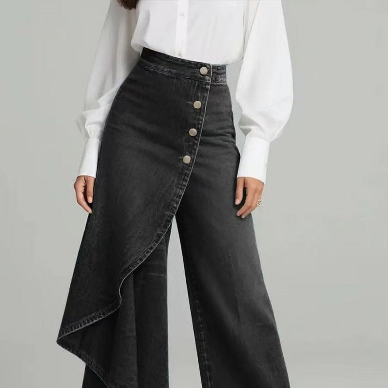 Black denim skirt with button details worn by a person on a gray background