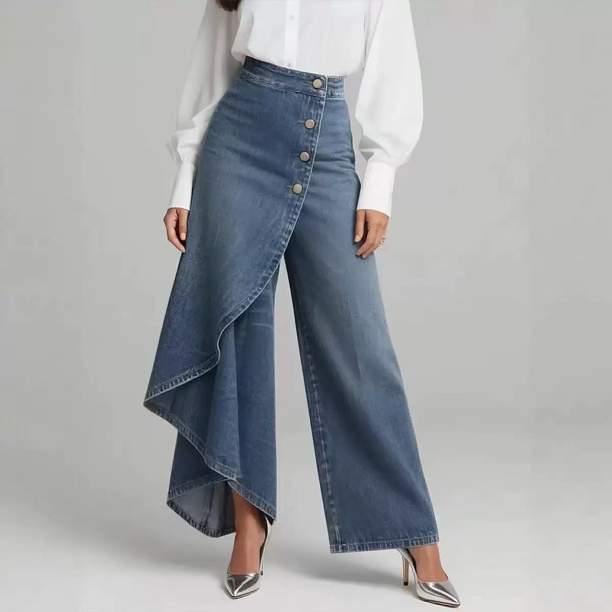 Blue denim wide-leg pants worn with a white blouse on a gray background