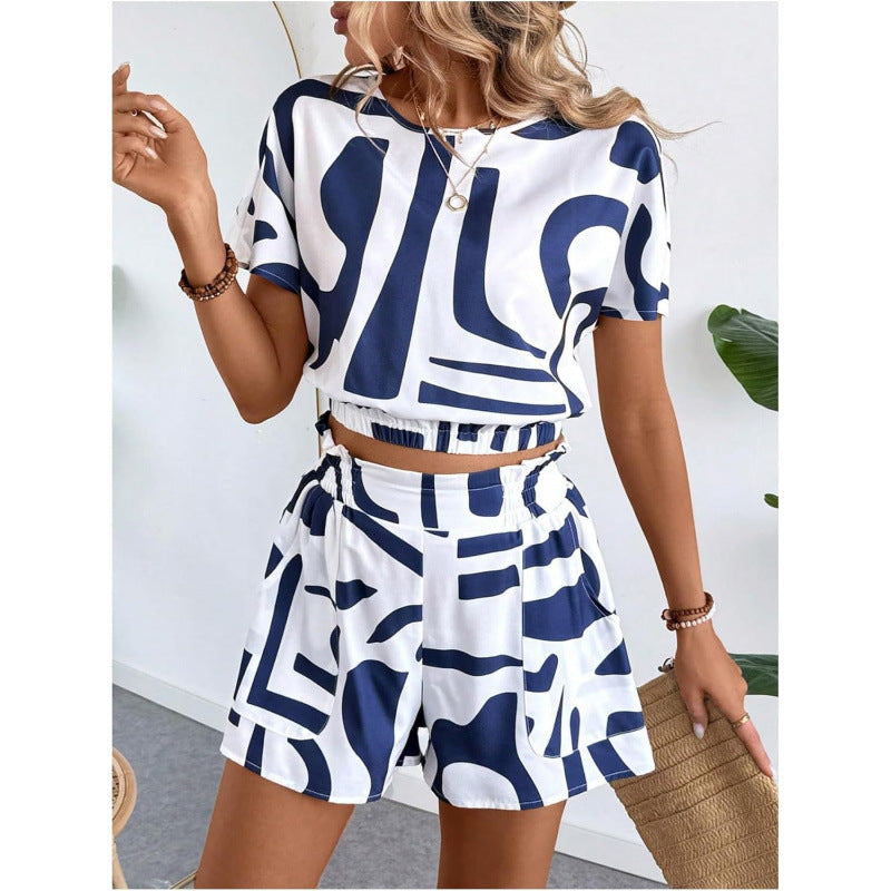 Woman wearing a blue and white patterned outfit with a white background