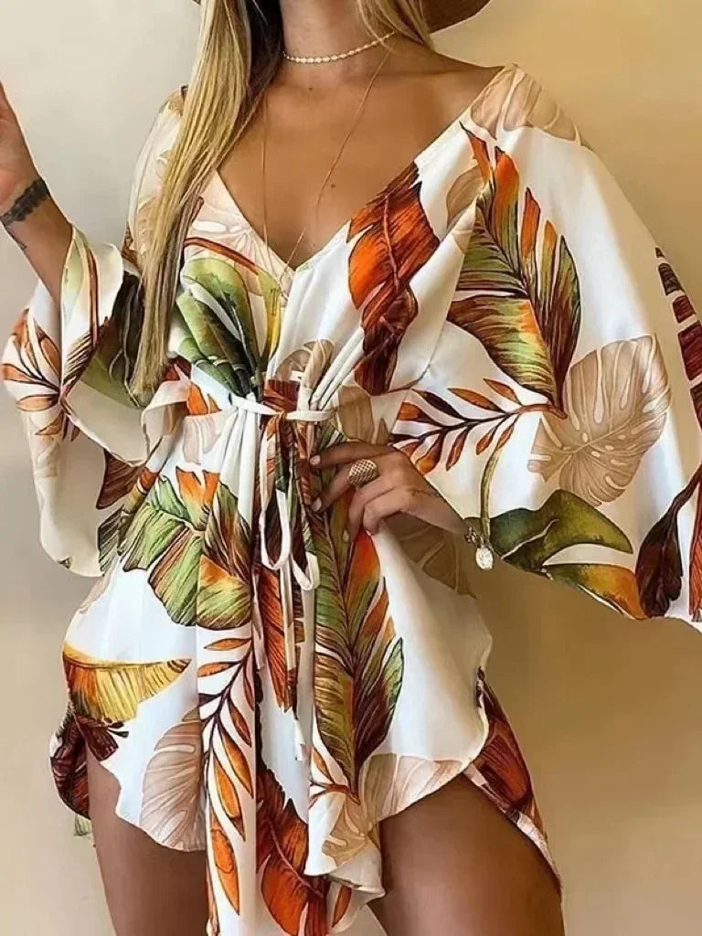 Woman wearing a floral off-shoulder top with a neutral background
