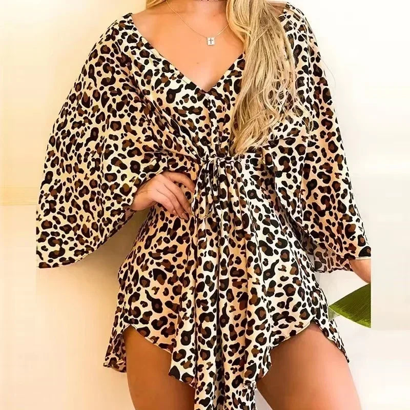 Leopard print dress worn by a person on a plain background