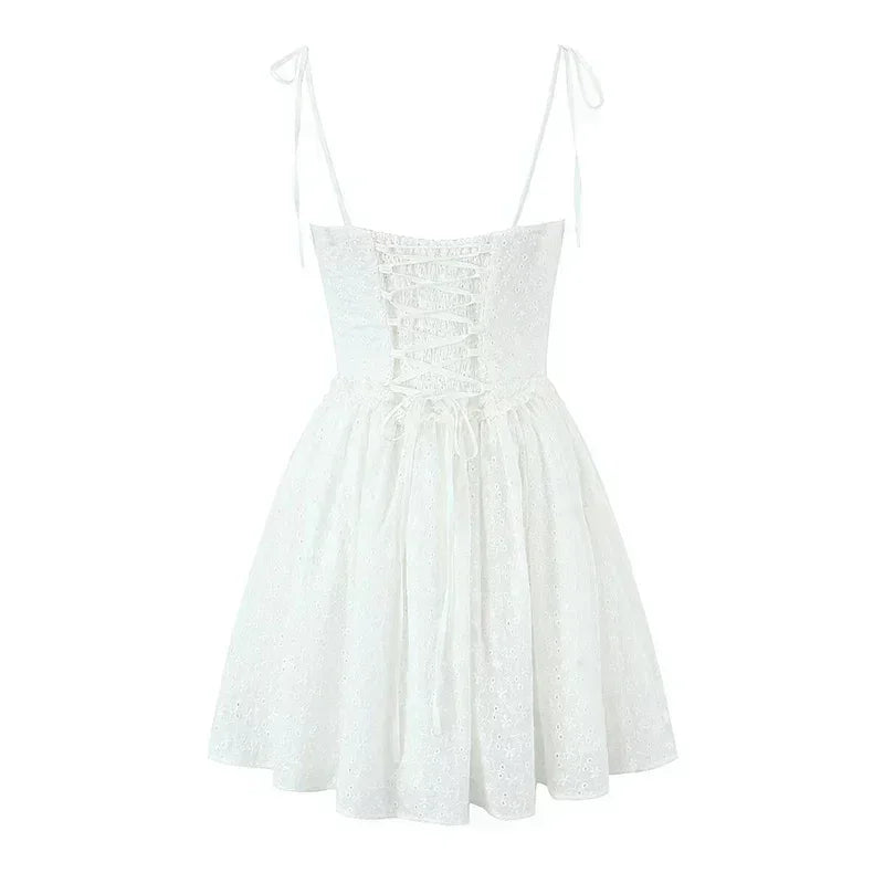 YENKYE Sexy Elegant Women Hollow Out Embroidery Yellow Sling Mini Dress Low Waist Lace Up Bandage Party Dresses Birthday Robe