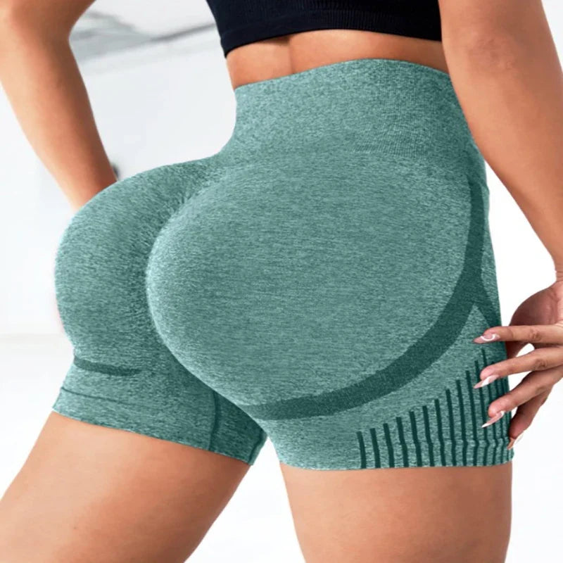 Green athletic shorts worn by a person on a white background
