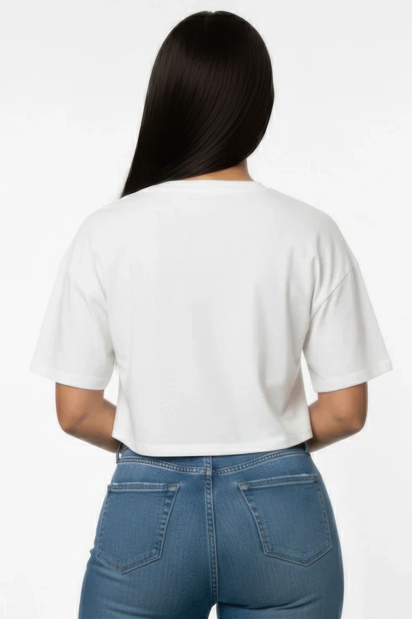 Person wearing a white t-shirt and blue jeans on a white background and showing the back of the tshirt