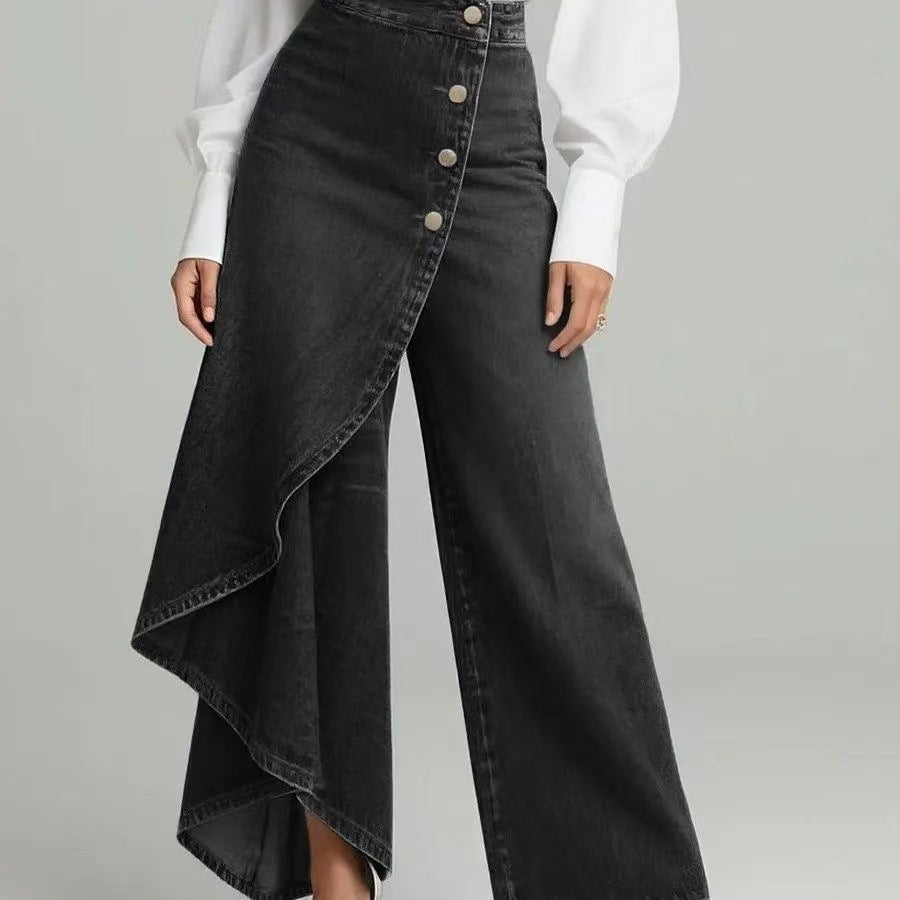 Person wearing a black denim skirt with a white shirt on a gray background