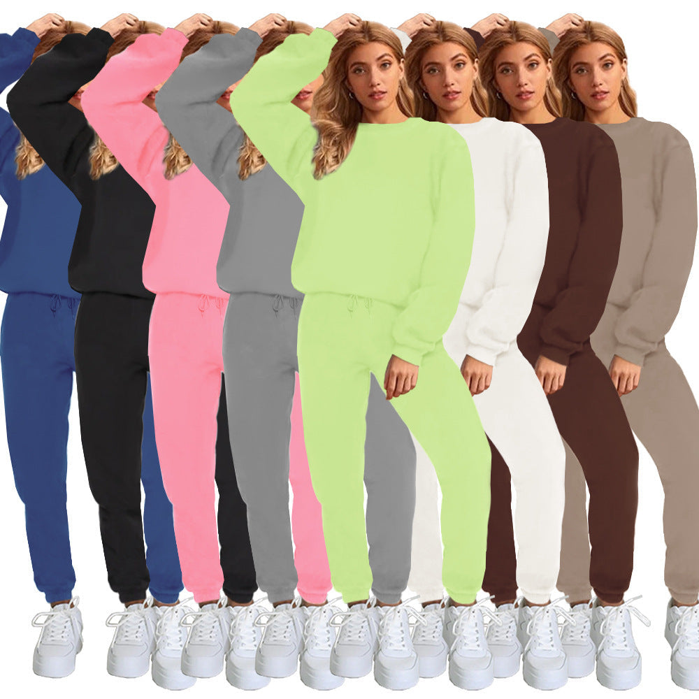 Woman wearing a green tracksuit with multiple color options displayed on a white background