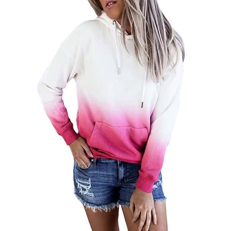 Person wearing a white and pink gradient hoodie with denim shorts on a white background